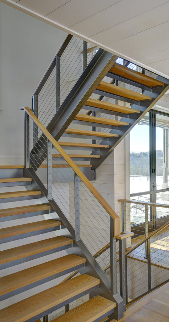 Rustic C Channel stair stringers on switchback stairs. 