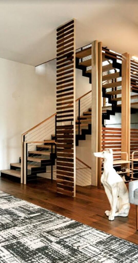 Double stringer stair styles with zig zag stringers and wood treads in a modern home
