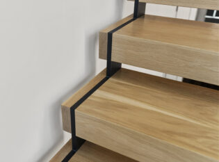 Zig zag stringer slices through wood treads