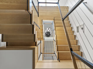 Sleek double stair stringers and cable railings