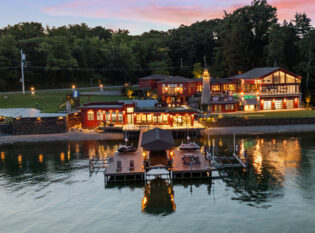 Lake house curved stairs and railings