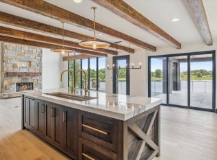 Rustic modern kitchen with rough hewn ceiling beams