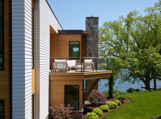 Modern Deck with natural wood and stone chimney.